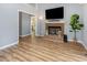 Bright living room with beautiful hardwood floors and fireplace at 6004 Volant Dr, Raleigh, NC 27609