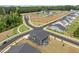 New construction home with a dark gray exterior and ample lawn space in a Primary-planned community at 601 Lauren Ann Dr, Apex, NC 27523