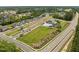 Aerial view of new construction homes and community amenities, including a pool, tennis courts, and dog park at 601 Lauren Ann Dr, Apex, NC 27523