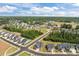 A residential neighborhood with multiple new homes and construction on a clear, sunny day at 601 Lauren Ann Dr, Apex, NC 27523