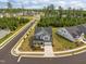Aerial view of a gray two-story home on a corner lot in a neighborhood with mature trees at 601 Lauren Ann Dr, Apex, NC 27523