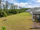 Large backyard with a lush green lawn and ample space, creating a serene outdoor environment at 601 Lauren Ann Dr, Apex, NC 27523