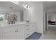 Elegant bathroom featuring double sinks, white cabinetry, and a spacious vanity area at 601 Lauren Ann Dr, Apex, NC 27523
