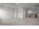 Spacious bonus room with neutral carpet and access to the hallway and staircase at 601 Lauren Ann Dr, Apex, NC 27523