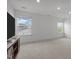 Bright bonus room with neutral carpet, recessed lighting, and two windows offering plenty of natural light at 601 Lauren Ann Dr, Apex, NC 27523