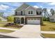 Charming two-story home with brick and siding, manicured lawn, and attached two car garage at 601 Lauren Ann Dr, Apex, NC 27523