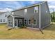 Charming home featuring a two-story design with dark gray siding and a well-manicured lawn at 601 Lauren Ann Dr, Apex, NC 27523