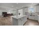 Spacious kitchen with a large center island, ample counter space, and seamless flow to living areas at 601 Lauren Ann Dr, Apex, NC 27523