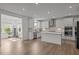 Bright kitchen featuring white cabinets, an island, stainless steel appliances, and an open layout at 601 Lauren Ann Dr, Apex, NC 27523