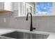 Kitchen area boasting modern fixtures, a deep stainless sink, and bright natural light at 601 Lauren Ann Dr, Apex, NC 27523