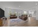 Spacious living room has hardwood floors, neutral walls, recessed lights and is open to the kitchen at 601 Lauren Ann Dr, Apex, NC 27523