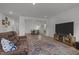 Spacious living room with hardwood floors open to dining area and neutral color palette at 601 Lauren Ann Dr, Apex, NC 27523