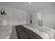 Comfortable bedroom featuring plush comforter and convenient access to closet and ensuite bathroom at 601 Lauren Ann Dr, Apex, NC 27523