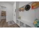 Practical mudroom featuring a bench with storage, coat hooks, and easy access to pantry at 601 Lauren Ann Dr, Apex, NC 27523