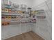 Walk-in pantry featuring organized shelving for ample food and supply storage at 601 Lauren Ann Dr, Apex, NC 27523