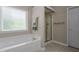 Bright bathroom featuring a bathtub, a window that provides natural light, and a shower at 708 Cheselden Dr, Durham, NC 27713