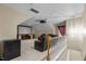 Carpeted bonus room featuring a mounted projector and screen for movie nights with comfortable leather seating at 708 Cheselden Dr, Durham, NC 27713
