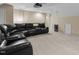 Finished bonus room with plush sectional sofa, projector and screen, mini-fridge, ideal for recreation and entertainment at 708 Cheselden Dr, Durham, NC 27713