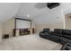 Spacious bonus room with a projector and large screen, perfect for entertainment and relaxation at 708 Cheselden Dr, Durham, NC 27713