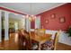 Cozy dining room with hardwood floors, chandelier, and decorative wall art at 708 Cheselden Dr, Durham, NC 27713