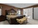 The main bedroom suite includes a large bed and a view into the connected primary bathroom at 708 Cheselden Dr, Durham, NC 27713