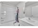 Bright bathroom featuring a white tub/shower combination and modern vanity with sink and faucet at 717 Little Patch St, Zebulon, NC 27597
