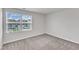 Comfortable bedroom featuring a window view, neutral walls, and plush carpet for a cozy feel at 717 Little Patch St, Zebulon, NC 27597