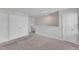 Bedroom with neutral colored carpet, white walls, with windows and closet at 717 Little Patch St, Zebulon, NC 27597