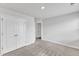 Bedroom with carpet, neutral walls, and a view into the hallway, with a double-door closet at 717 Little Patch St, Zebulon, NC 27597