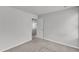 A carpeted bedroom reveals neutral walls, a view into the hallway, and ample natural light at 717 Little Patch St, Zebulon, NC 27597