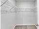 Walk-in closet featuring carpeted floors, white walls, and wire shelving throughout at 717 Little Patch St, Zebulon, NC 27597