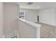 Upstairs landing features neutral walls, carpeted floors, and a window with natural light at 717 Little Patch St, Zebulon, NC 27597