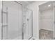 Bathroom featuring a bright glass shower with a white enclosure, and views of the walk-in closet at 717 Little Patch St, Zebulon, NC 27597