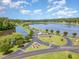 Aerial view of a serene lake community with well-manicured grounds and inviting waterways for residents at 790 Cashmere Ct, Sanford, NC 27332