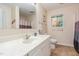 Bathroom with a cream colored vanity, tile flooring, a window, and neutral walls at 790 Cashmere Ct, Sanford, NC 27332