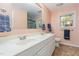 Bathroom with dual sinks, modern fixtures, and a large mirror at 790 Cashmere Ct, Sanford, NC 27332