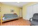 Bedroom with a futon, closet, and a window providing natural light, creating a bright and airy atmosphere at 790 Cashmere Ct, Sanford, NC 27332
