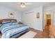 Bedroom with hardwood floors, a ceiling fan, closet, and a window providing lots of natural light at 790 Cashmere Ct, Sanford, NC 27332