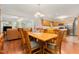 Open-concept dining room featuring wood floors and seamlessly connecting to an adjacent kitchen at 790 Cashmere Ct, Sanford, NC 27332