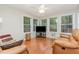 Cozy sun room filled with natural light and views from the surrounding windows with comfortable seating at 790 Cashmere Ct, Sanford, NC 27332
