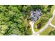 An aerial view of a beautiful home with a landscaped backyard and private patio at 7932 Twin Pines Way, Fuquay Varina, NC 27526