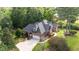 Brick home features mature landscaping, a large driveway, and a two-car garage at 7932 Twin Pines Way, Fuquay Varina, NC 27526