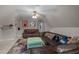 Bonus room featuring a leather sofas, sports memorabilia, ceiling fan, and carpeted floors at 7932 Twin Pines Way, Fuquay Varina, NC 27526