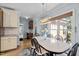 Light filled dining room with a modern chandelier and a large window at 7932 Twin Pines Way, Fuquay Varina, NC 27526