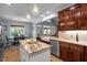 Well-designed kitchen open to a dining room features an island and stainless steel appliances at 7932 Twin Pines Way, Fuquay Varina, NC 27526