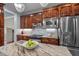 Modern kitchen with stainless steel appliances, marble backsplash and a island featuring a marble countertop at 7932 Twin Pines Way, Fuquay Varina, NC 27526