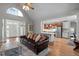 Spacious living room open to the kitchen with island and stainless steel appliances at 7932 Twin Pines Way, Fuquay Varina, NC 27526