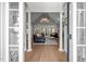Elegant living room featuring hardwood floors, cathedral ceilings, and a fireplace at 7932 Twin Pines Way, Fuquay Varina, NC 27526
