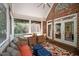 Covered screened porch boasts ample seating, a dining area, and access to the backyard at 7932 Twin Pines Way, Fuquay Varina, NC 27526