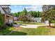 Street view of home, showing driveway and other homes in neighborhood at 7932 Twin Pines Way, Fuquay Varina, NC 27526